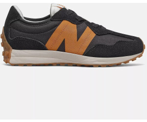 New balance store junior black trainers