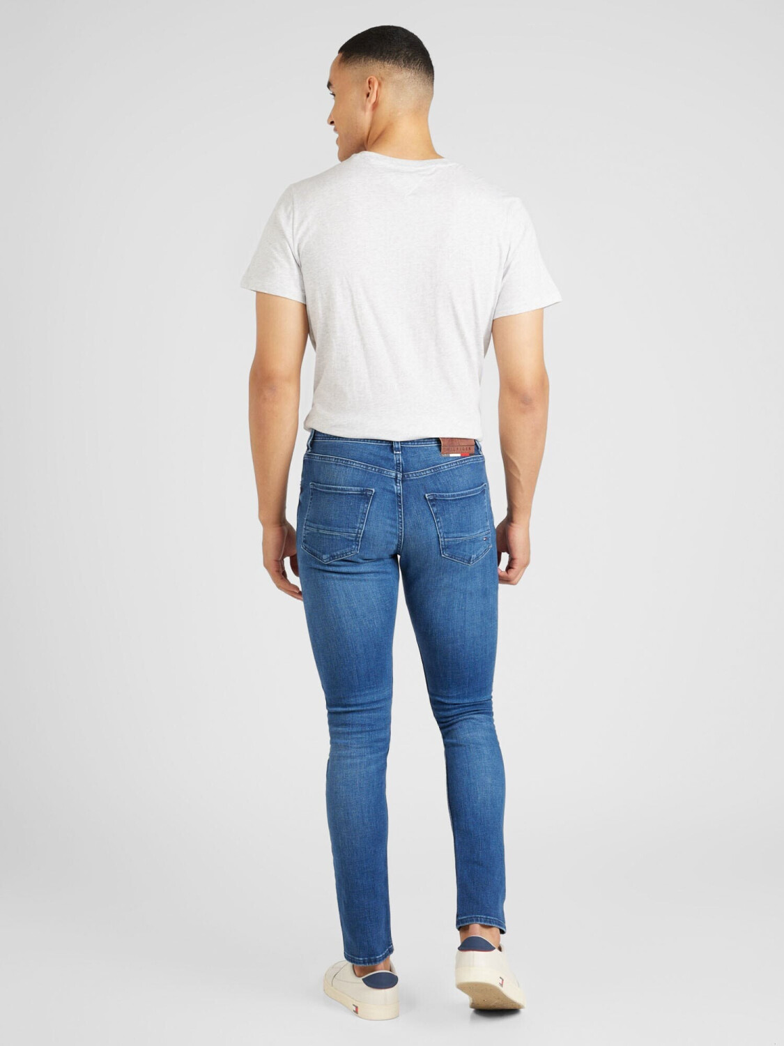 Tapered distressed jeans hot sale