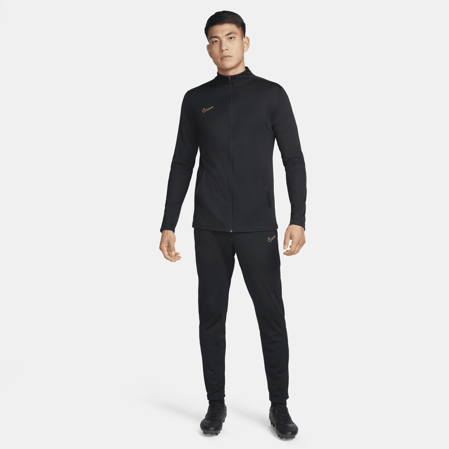 Nike tracksuit black and gold sales