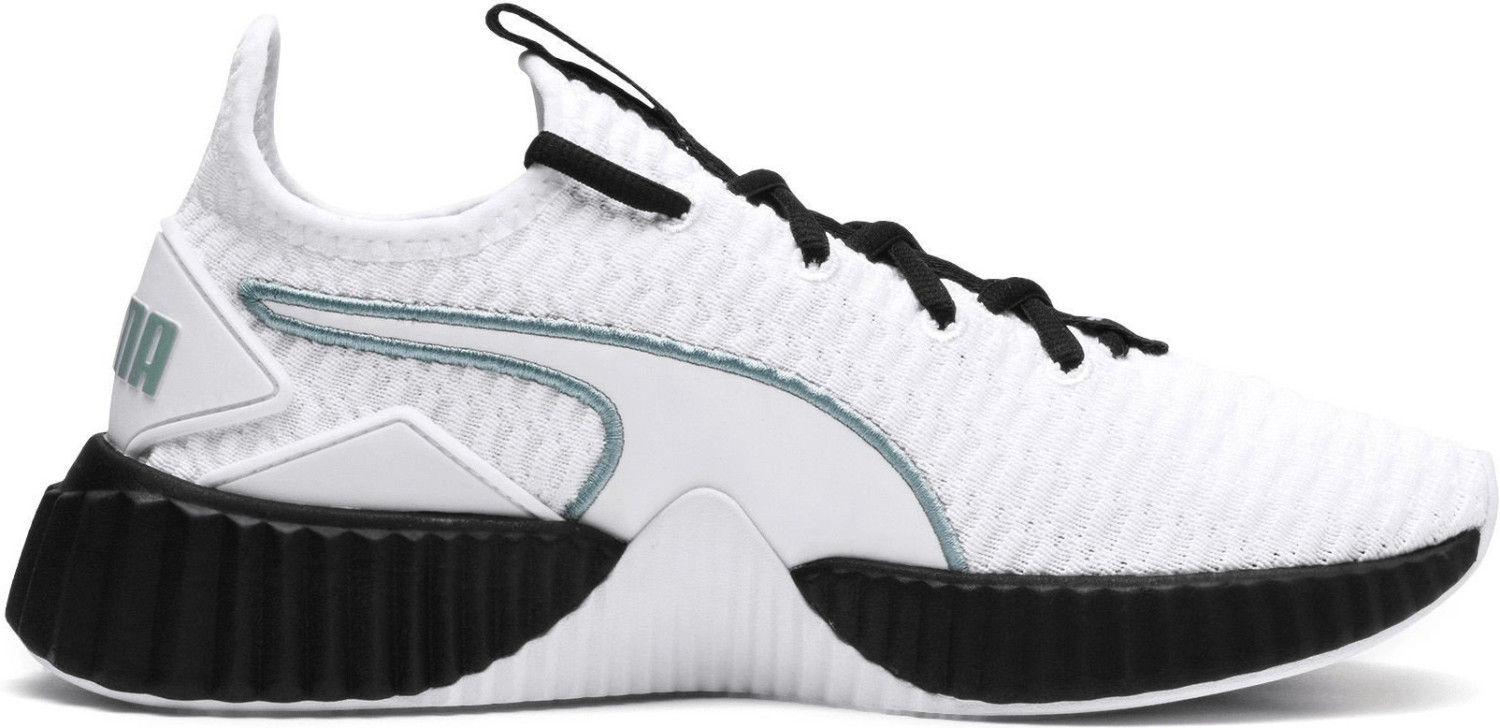 puma defy sneakers in white