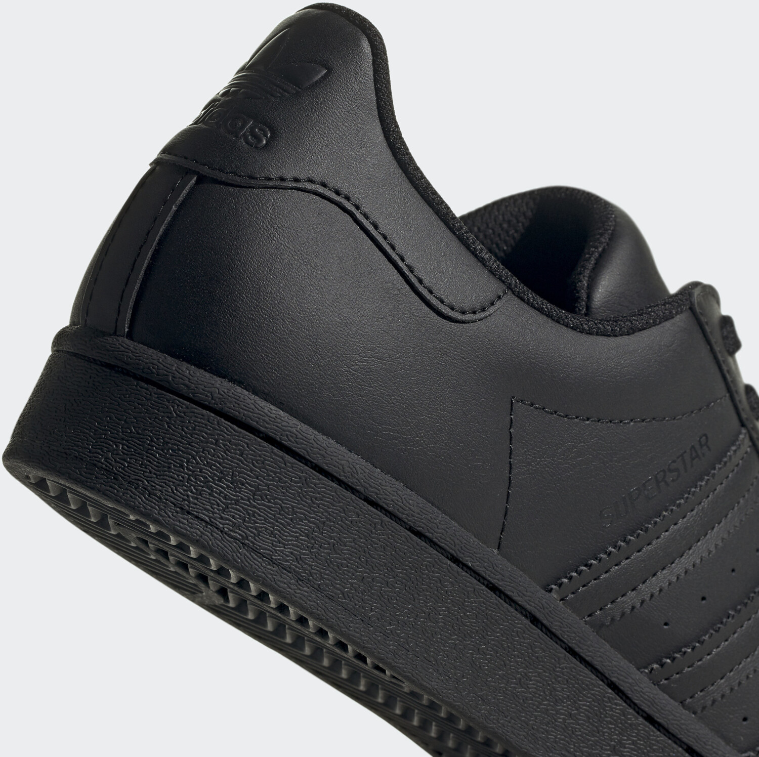 Solid black adidas best sale