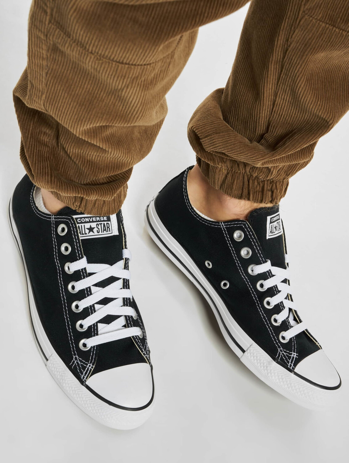 Black short converse shoes discount